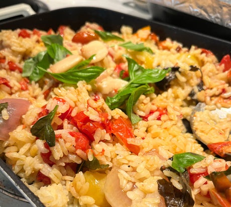 image of baked rice with cherry tomatoes in a caserole dish